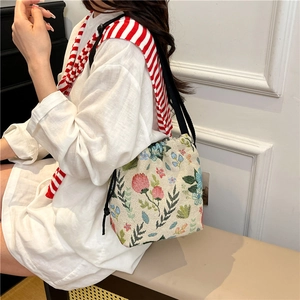 Floral jacquard canvas bucket bag with black drawstring and retro garden pattern