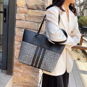 Minimalist paneled PU tote bag featuring tweed fabric and black leather straps for women