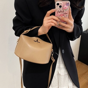 Chic light brown leather crossbody bag with gold twist lock for stylish women