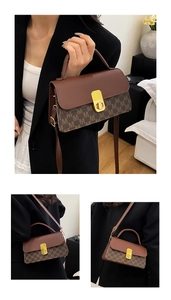 Detail of the brown monogram crossbody bag with gold metallic lock and leather handle