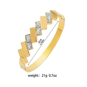 Gold plated stainless steel geometric cuff bracelet with cubic zirconia square accents