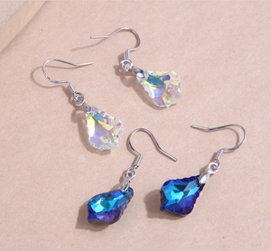 Close-up of teardrop crystal earrings in iridescent white and navy blue with S925 silver hooks