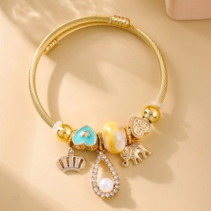 Elegant gold twisted wire charm bracelet with blue heart and elephant pendants