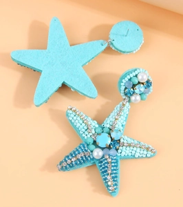 Detailed view of handmade beaded starfish earrings with crystals and faux pearls
