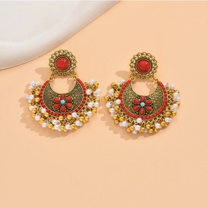 Ethnic style gold crescent earrings with ruby floral inlay and pearl tassel fringe