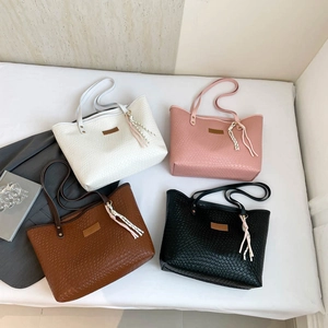 Four woven texture tote bags in white pink brown and black for stylish commuting