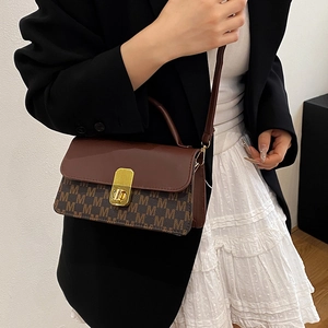 Vintage crossbody square bag with M-letter print and gold metal lock on female model