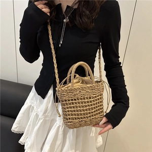 Handmade woven straw bucket bag with drawstring liner for summer beach vacation