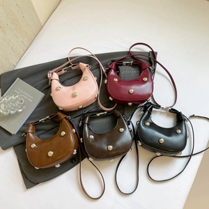 Fashionable half-moon hobo bag with silver rivets available in five matte colors