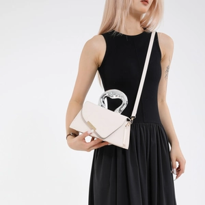 Minimalist beige small square bag with hollow heart metal handle and shoulder strap
