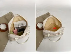 Internal compartments of the beige nylon versatile backpack for books and tablet