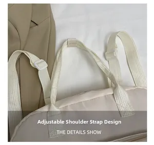Detail of adjustable woven shoulder strap with plastic buckle on beige nylon backpack