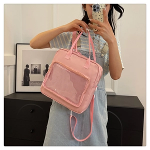 Pink multi-functional Ita-bag with large clear mesh pocket and adjustable straps