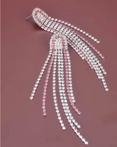 Close-up of elegant tassel earrings with silver finish and pink and white rhinestones