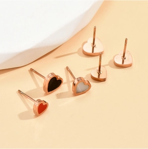 Titanium steel heart stud earrings set in rose gold with black, white and red enamel