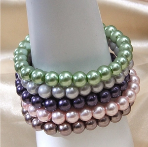 Detail of five-layer multi-color pearl bracelets with pearlescent finish on wrist