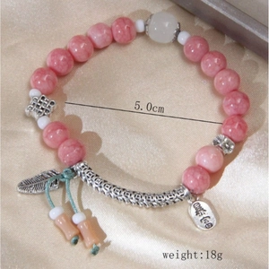 Pink natural stone beaded bracelet with silver feather and fortune charms for women