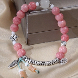 Pink marble bead bracelet with silver feather charms and chinese character pendants