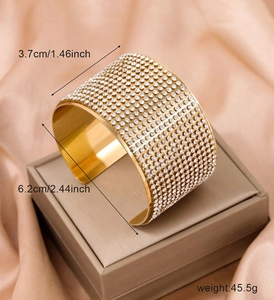 Detailed view of golden open cuff bracelet with dimensions showing 3.7cm width and rhinestones