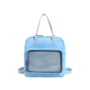 Light blue multi-use school backpack with mesh pocket and dual carrying handles