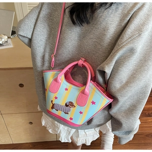 Detail of dachshund print crossbody bag with colorful pink straps and yellow stripes