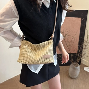 Fashionable woven straw tote bag with shoulder strap for casual summer beach holidays