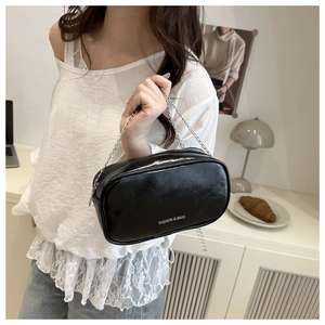 Glossy black fashion handbag with silver chain strap and white text logo detail