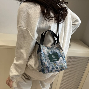 Vintage floral embroidered bucket bag with crossbody strap for stylish daily casual use