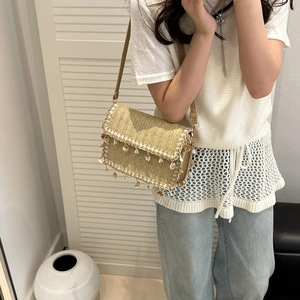 Ethnic straw crossbody bag with shell tassels and slim shoulder strap for women