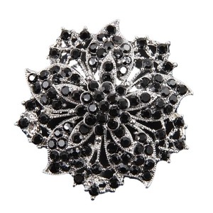 Sparkling multi-layer flower brooch featuring black rhinestones and silver-tone petals