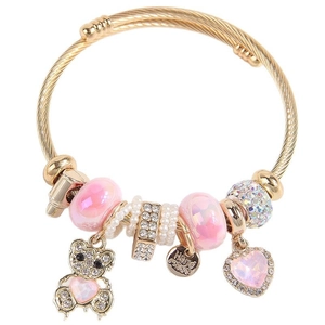 Golden open bangle featuring pink charms and a rhinestone bear pendant for a trendy DIY style