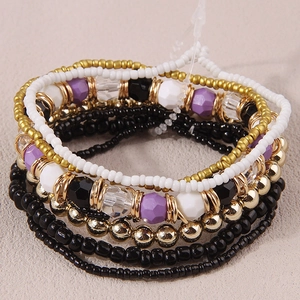 Bohemian multilayer beaded bracelet set with purple resin and golden metal accents