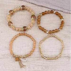Bohemian multilayer beaded bracelet set with glass beads and metallic tassel charms