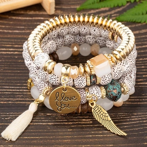 4-piece Bohemian multilayer beaded bracelet set with wing charms and silk tassels
