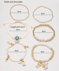 Detail of 6-piece Evil Eye and Hamsa Hand beaded bracelet set with size dimensions