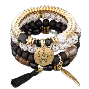 4pcs bohemian layered beaded bracelet set with black tassels and golden wing charms
