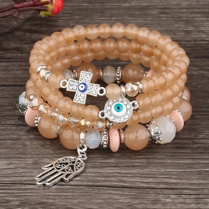 Five-layer beaded bracelet set with Hamsa hand and evil eye cross pendants in champagne gold