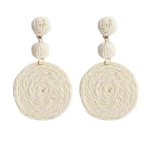 Bohemian style woven straw drop earrings with triple-tier flower and circular design