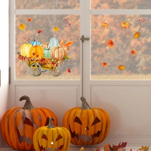 Detail view of pumpkin cart and maple leaf static window stickers for autumn decoration