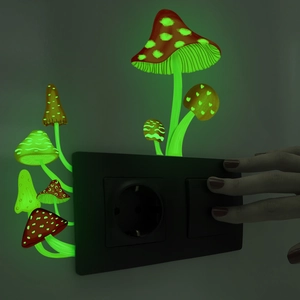 Luminous mushroom wall stickers glowing green on a light switch in the dark room