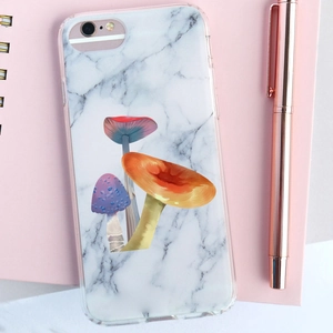 Close-up of iPhone 6 case with white marble texture and colorful mushroom illustrations