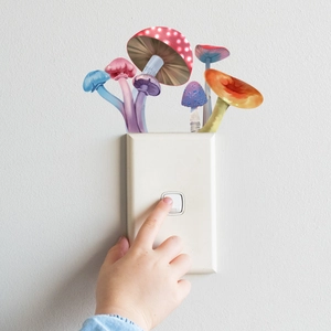 Macro detail of colorful mushroom light switch stickers in a creative home setting