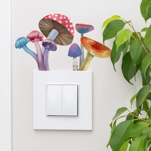 Luminous colorful mushroom wall decals applied above a white light switch in a cozy room