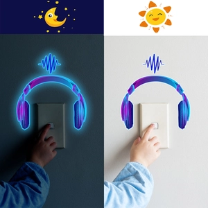 Glow in the dark headphone light switch sticker showing day and night contrast effects