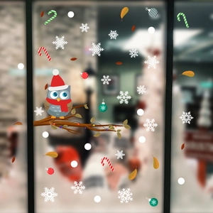 Christmas window sticker set with owl on branch and colorful snowflake decorations