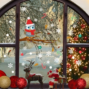 Christmas window stickers with owl, Santa and reindeer on snowy glass background