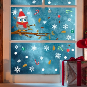 Christmas window decals with owls and snowflakes on glass for holiday home decoration