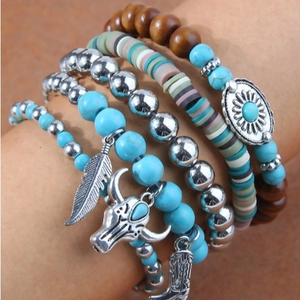 Bohemian multi-layer bracelet set with turquoise beads, feathers, and bull skull charms