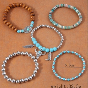 Bohemian 5-piece stretch bracelet set with turquoise beads, feather and bull head charms