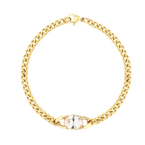 Macro view of gold plated cuban chain bracelet featuring a large oval cubic zirconia pendant
